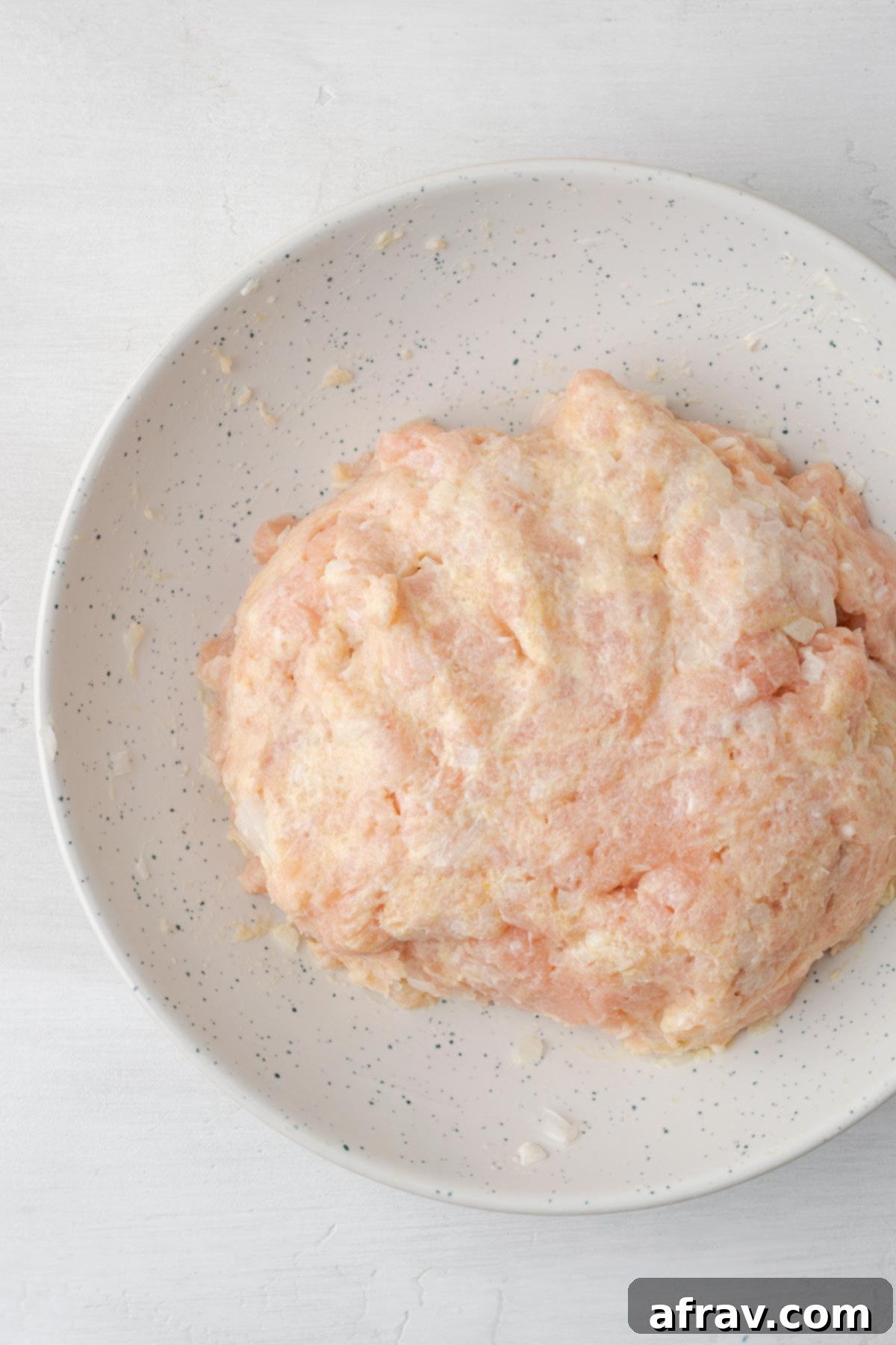 Perfectly Juicy Air Fryer Turkey Burgers 5 Mixed turkey burger ingredients in a bowl.