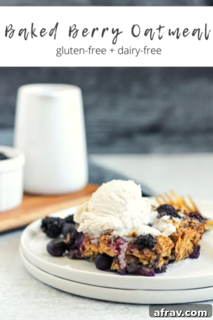Close-up of a baked berry oatmeal slice, showcasing the texture and fruit, ready to be served