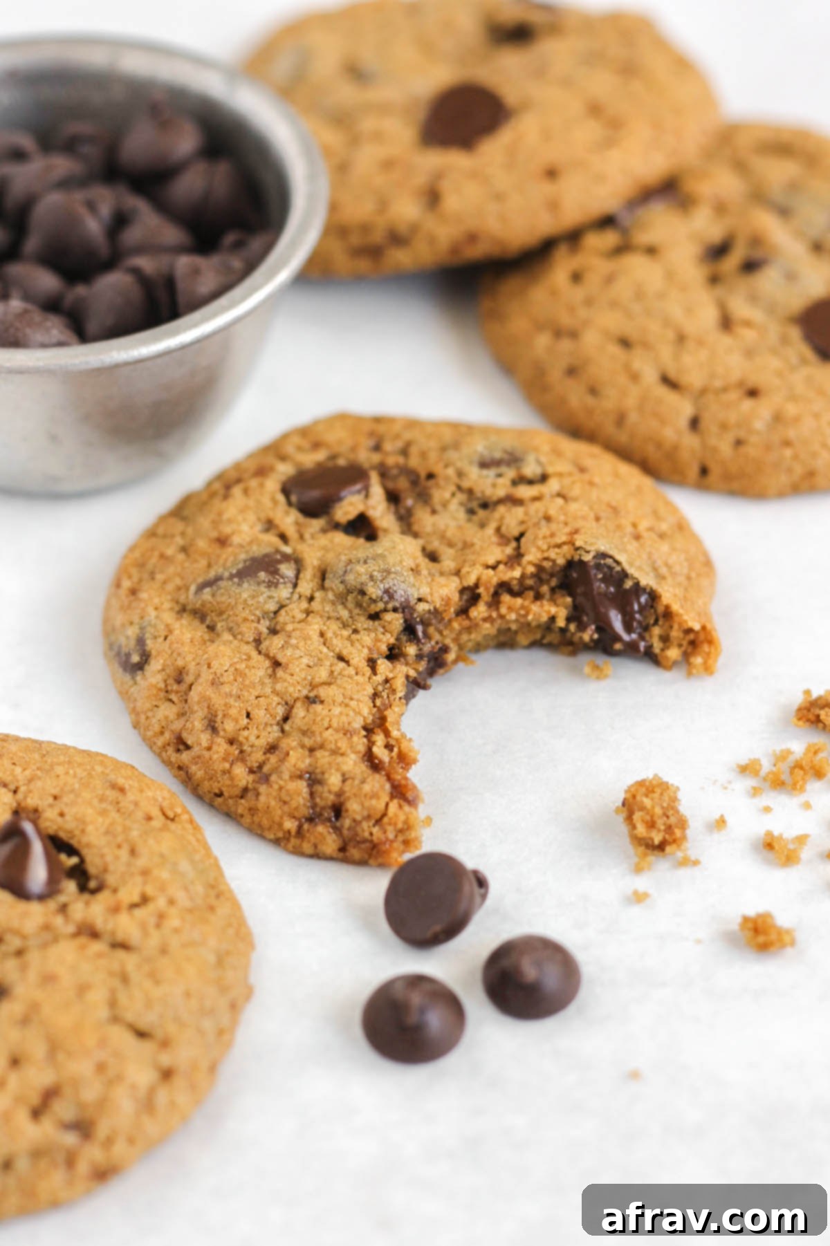 Oat flour chocolate chip cookie with a bite taken out.
