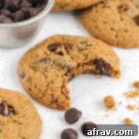 Oat flour chocolate chip cookie with a bite taken out.