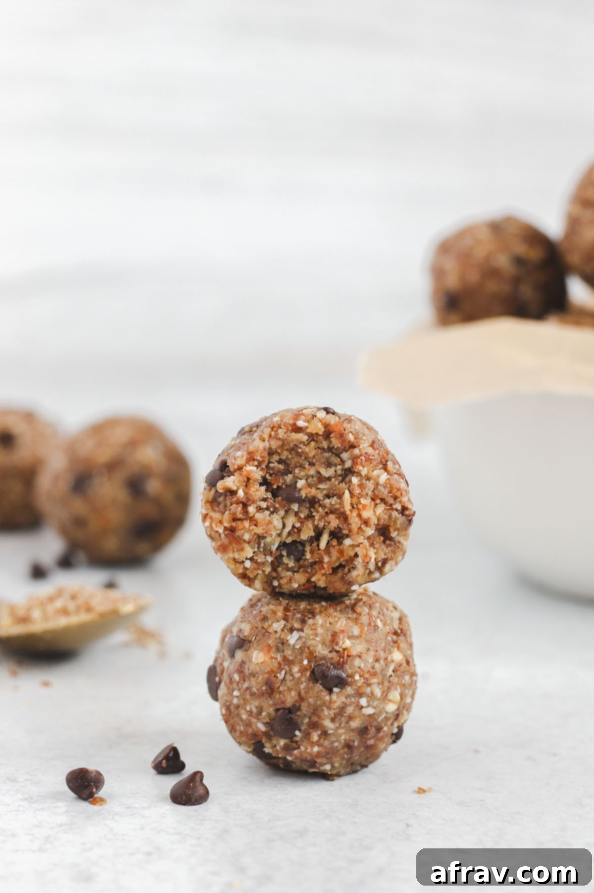 Nut Free Gluten Free Dairy Free Power Bites 6 Several energy balls neatly stacked two high, emphasizing their uniform shape and appealing texture.