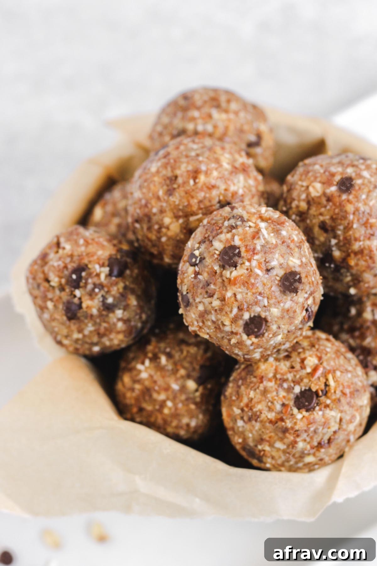 Nut Free Gluten Free Dairy Free Power Bites 7 A rustic bowl brimming with freshly made nut-free energy balls, ready for serving.