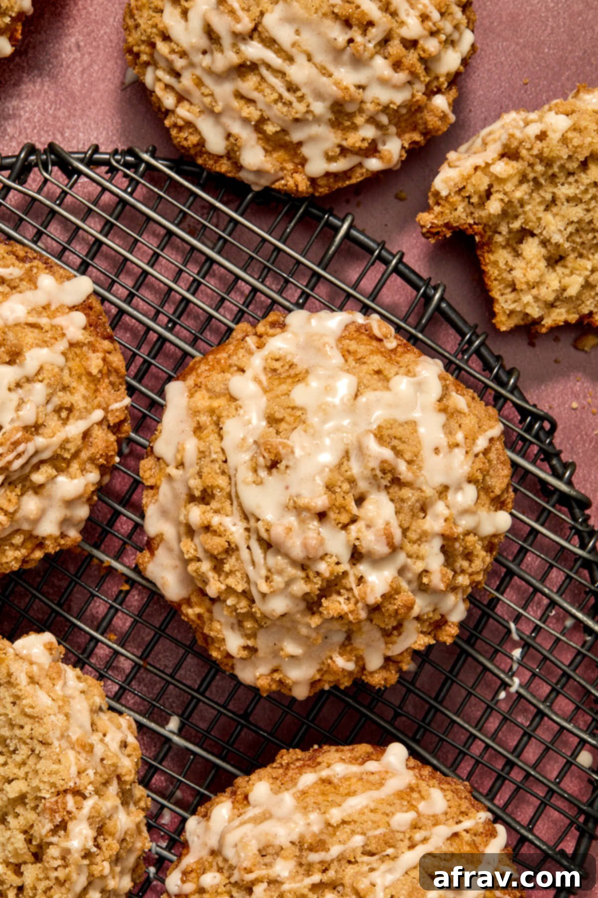Overhead of muffins on a wire rack and topped with glaze.