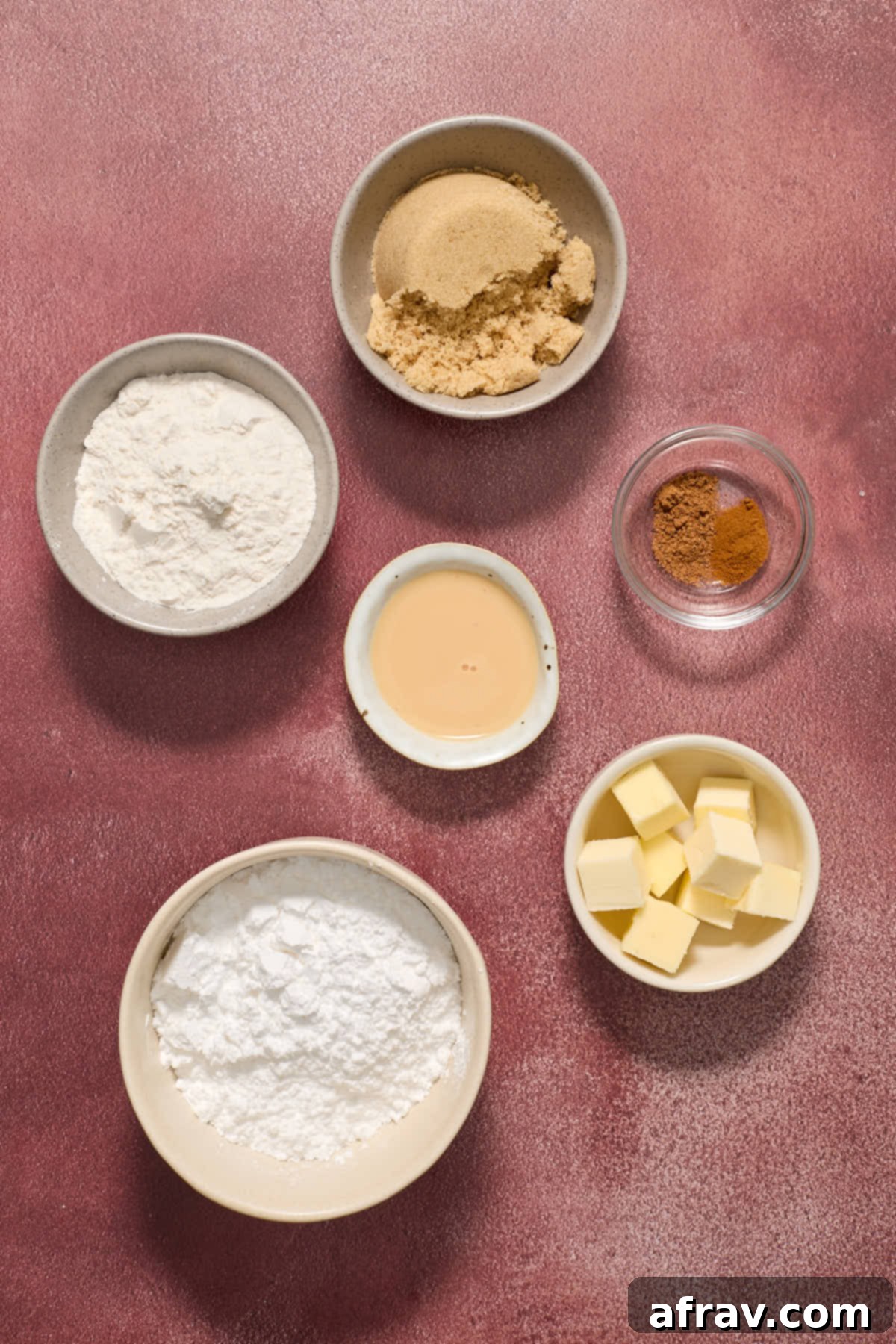 Ingredients to make the streusel topping and eggnog glaze in individual bowls.