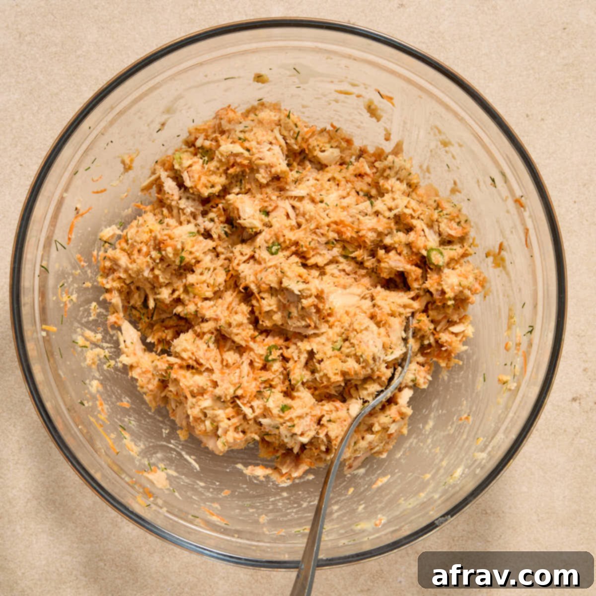 Air Fryer Tuna Cakes with Cheddar & Carrot Zest 6 All tuna cake ingredients mixed together in a bowl with a fork.