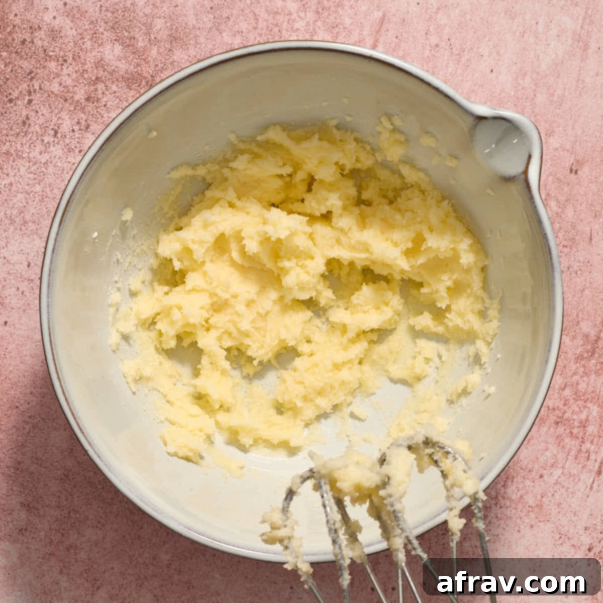 Almond Dream Bars: Chewy, Creamy, and Irresistibly Good 5 Butter and sugar creamed together in a white bowl.