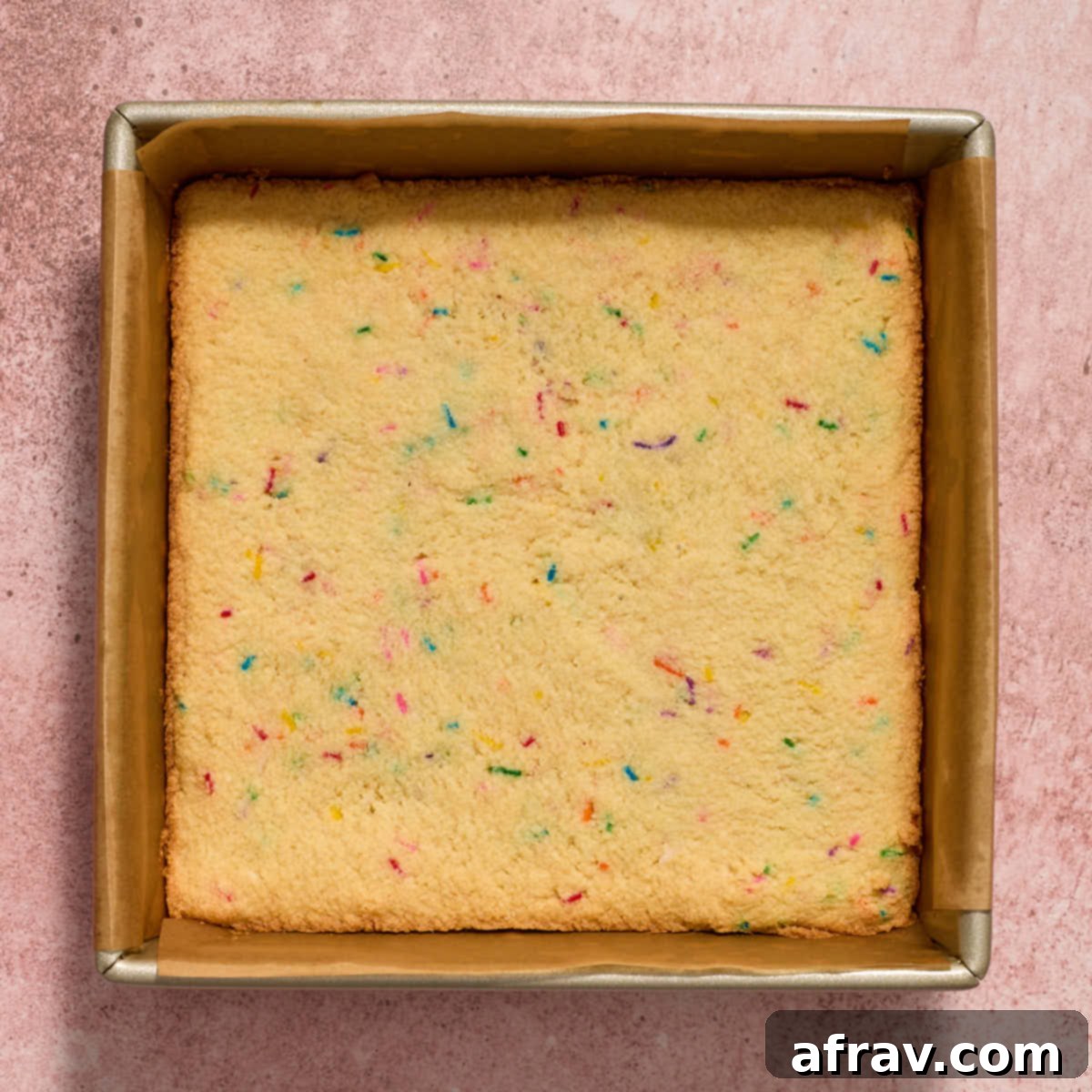 Almond Dream Bars: Chewy, Creamy, and Irresistibly Good 10 Baked sugar cookie bars in the pan.