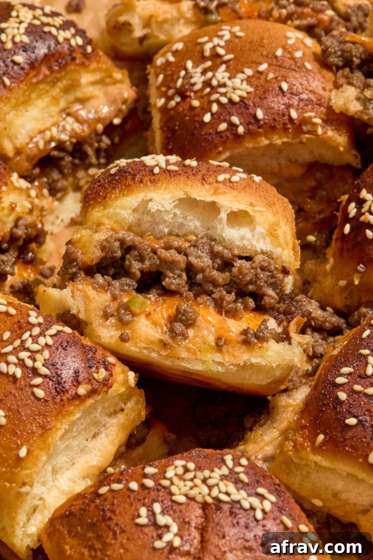 Air Fryer Mini Cheeseburgers 12 Close up of a slider resting on top of another one.