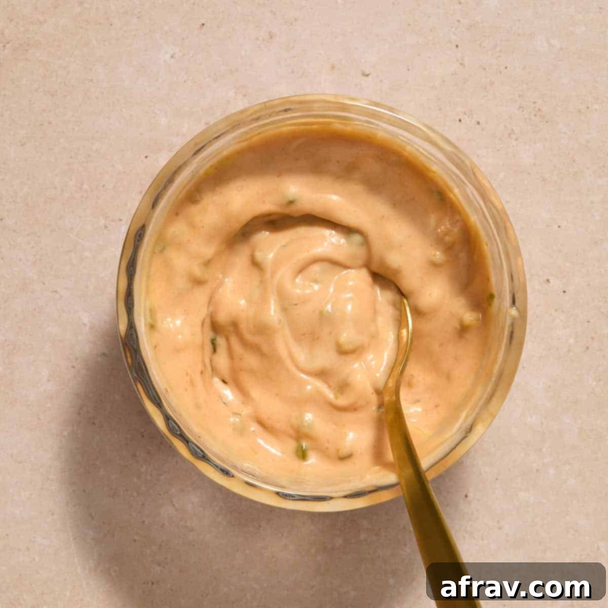 Air Fryer Mini Cheeseburgers 5 Burger sauce mixed together in a small glass bowl with a spoon.